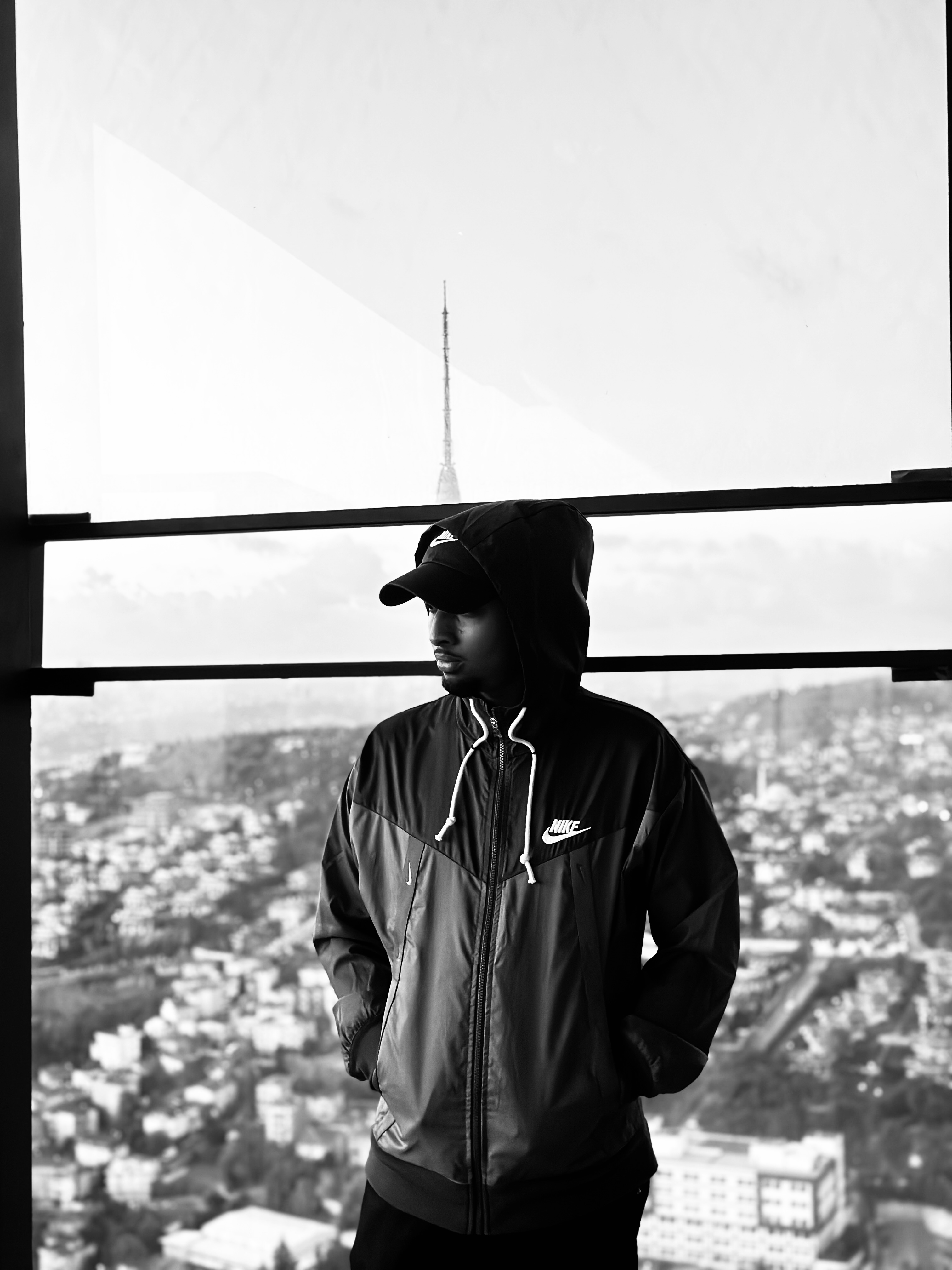 Abdi Ismail — product builder and designer standing above a city skyline